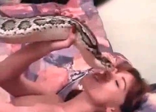 Redhead wants to fuck a huge snake