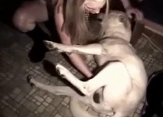 Golden blonde is playing with a big doggy