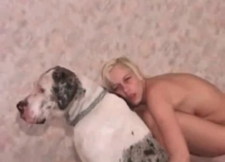 Dirty blonde plays with her white dog