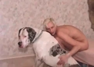 Dirty blonde plays with her white dog