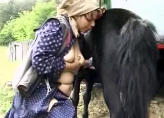 Angelic redhead farm lady and her animal