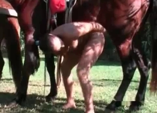 Slender farm girl enjoys her massive stallion