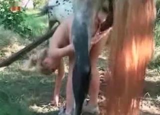 Jerking horse dick right in her cunt