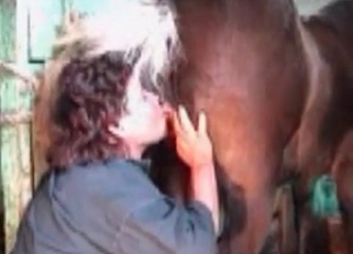 Dirty lady gives her horse a rimjob