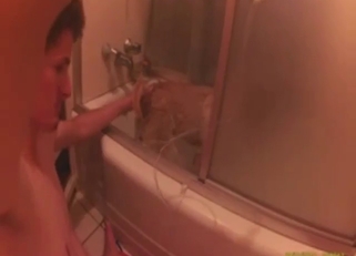 Dude is into enema play with his animals